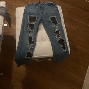 Some blue jeans with patches